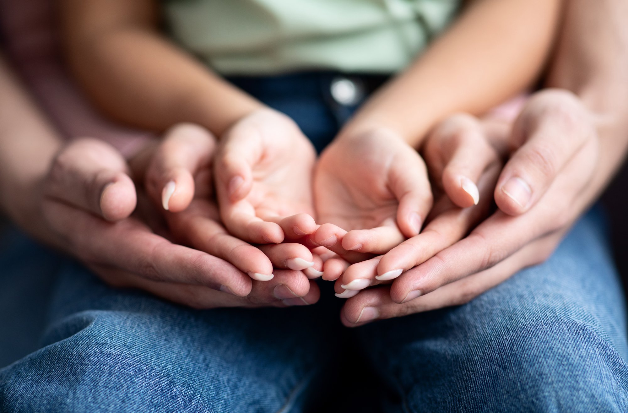 parents-and-child-placing-their-hands-together-cl-2025-03-18-18-36-39-utc